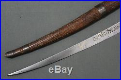 A fine long Berber flissa sword with a curved blade Late 19th early 20th c