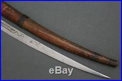 A fine long Berber flissa sword with a curved blade Late 19th early 20th c