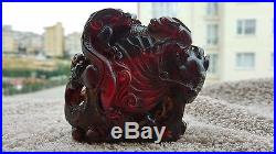 Amazingly Carved Chinese Cherry Amber Bakelite Dragon Statue