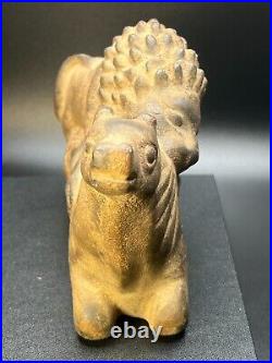 Ancient Carved Stone Figurine depicting a Lion Hunting an Animal