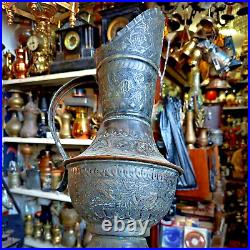 Antique Middle Eastern Copper Water Pitcher with Engraved Floral Design