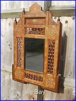 Antique Middle Eastern Islamic wall mirror, profusely inlaid, very decorative