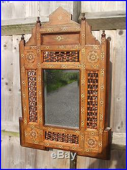 Antique Middle Eastern Islamic wall mirror, profusely inlaid, very decorative