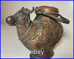 Antique handmade tooled Middle Eastern copper bull shaped holy water kettle pot