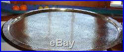 Large Ornate Moroccan Brass Circular Tray with wooden table stand